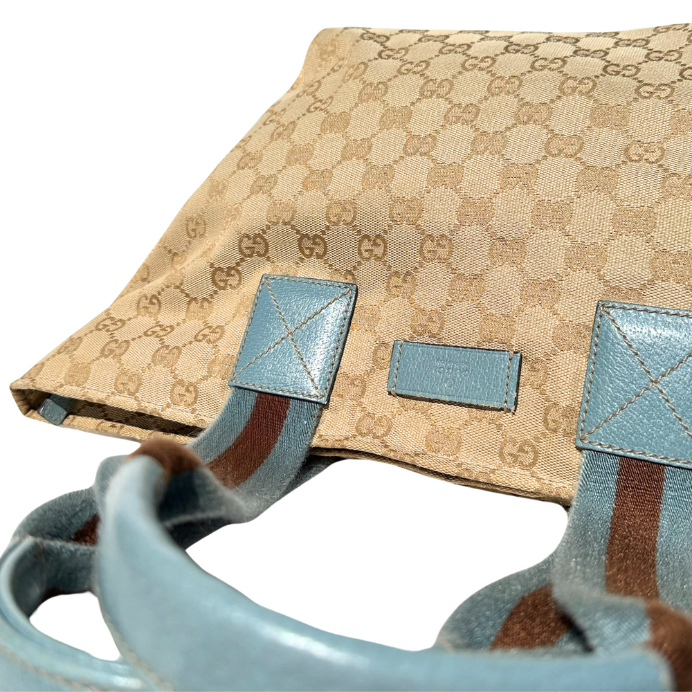 
                  
                    Gucci GG Canvas Zippered Tote- Blue + Brown
                  
                